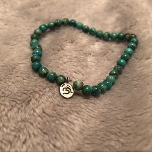 Satya bracelet- sterling silver Om sign